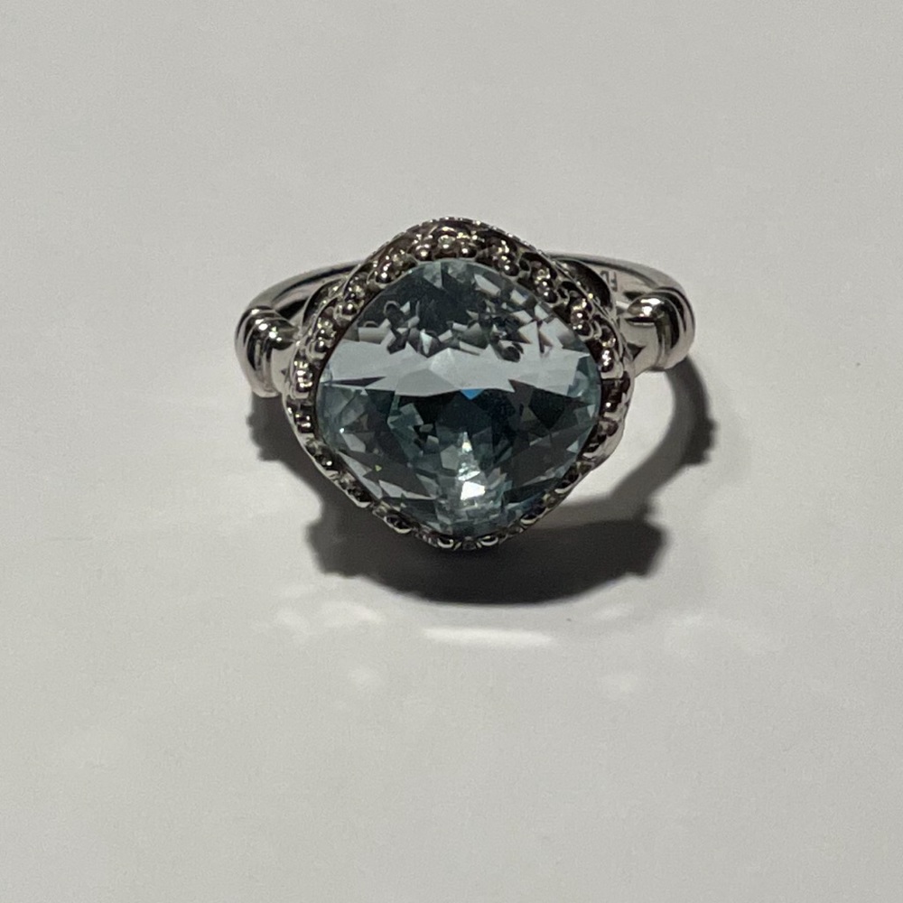 Very light blue topaz ring.